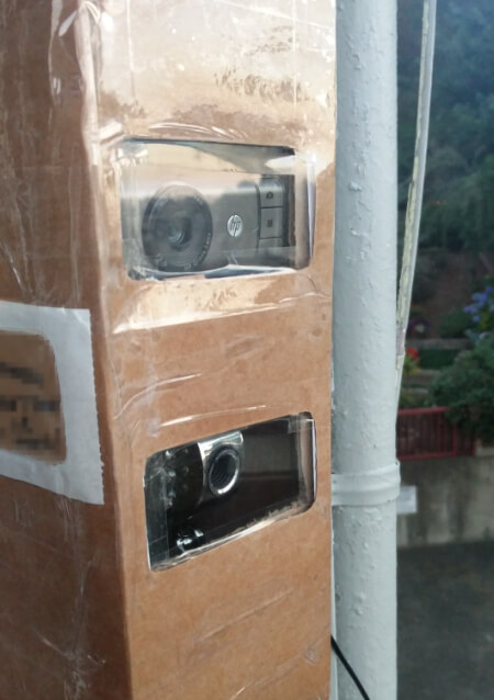 Cardboard tower with two cameras inside